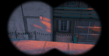 a sniper scope shows a building with a green railing