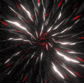 a black background with red and white lines that looks like a fireworks display