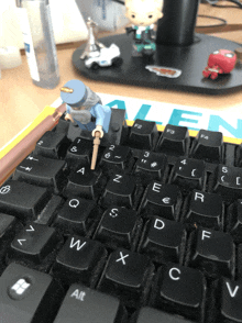 a keyboard with a lego figure on top of it