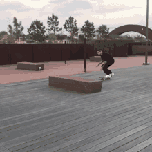 a man riding a skateboard down a wooden deck