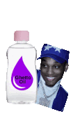 a bottle of ghetto oil next to a picture of a man in a blue hat