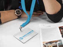 a lanyard with a sanitet sverige ab logo on it