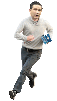 a man in a grey sweater is running while holding a blue box