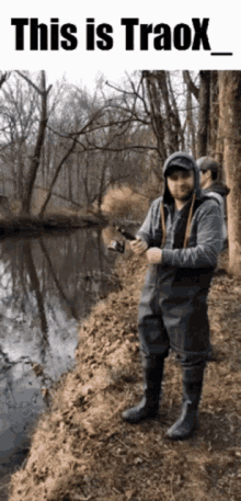 a man in waders is holding a fishing rod in front of a river with the caption " this is traox "