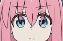 a close up of a pink haired anime girl 's face with blue eyes .