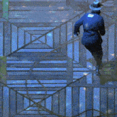 a man in a cowboy hat is walking down stairs