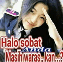 a woman is smiling and holding her hand to her forehead with the words halo sobat anda masih waras kan .