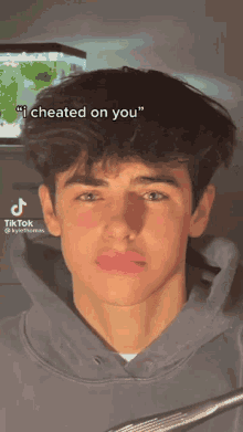 a young man with a caption that says " i cheated on you " on it