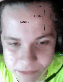 a close up of a person 's face with the words " kanye " written on the forehead