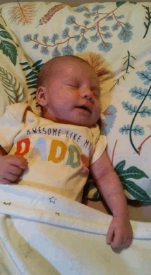 a baby wearing a shirt that says awesome like my dad