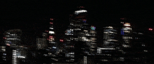 a blurry picture of a city skyline at night with the letters nv on the top