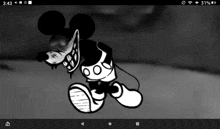 a black and white image of a mickey mouse with a mask on his face .