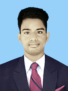 a man in a suit and tie with a pocket square