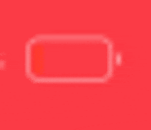 a blurred image of a battery on a red background