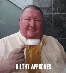 a man holding a glass of beer with the words " rilthy approves " above him