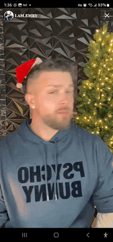 a man wearing a santa hat is wearing a shirt that says oh9y29 ymu8