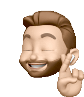 a man with a beard is wearing ear buds and smiling