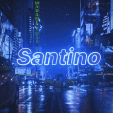 a neon sign that says santino in front of a city street