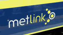 a metlink logo is on the side of a train