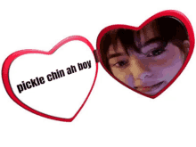 a heart shaped mirror that says pickle chin ah boy on it