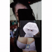 a woman is taking a picture of herself with a picture of a cartoon rabbit behind her