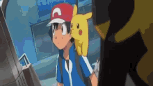 a boy is holding a pikachu on his back .