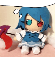 a stuffed doll with blue hair and a red eye is holding a windmill