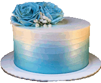 a blue and white cake with flowers on top