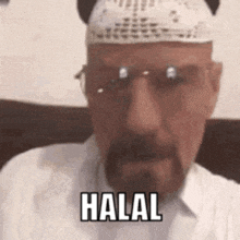 a man with a beard and a bandage on his head is wearing glasses and a hat and says halal .