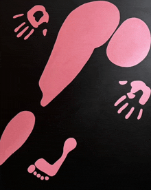 a black background with pink footprints and hands