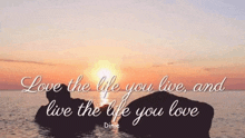 a picture of a sunset with the words love the life you live and live the life you love beneath it