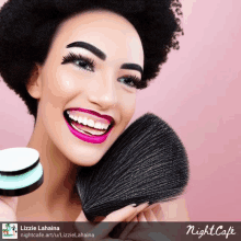 a woman is smiling and holding a makeup brush with night cafe written on the bottom right