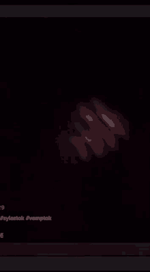 a blurry picture of a person 's hand in the dark