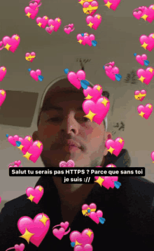 a man is surrounded by pink hearts and says salut tu serais pas https ? parce que sans toi je suis : //