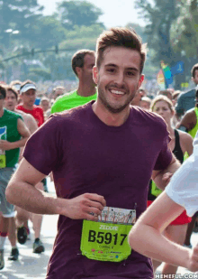 a runner with the number b5917 on his bib smiles