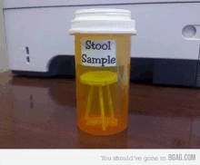 a pill bottle with a yellow stool in it