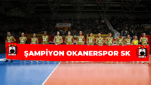 a group of volleyball players holding a banner that says ' sampiyon okanerspor sk ' on it