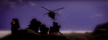 a helicopter is flying over a group of soldiers on a hill