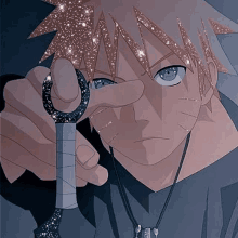 naruto is holding a sword in his hand and pointing at the camera .