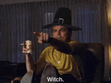 a man wearing a pilgrim hat is pointing at the camera with the word witch below him