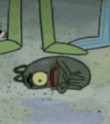 a cartoon character is laying on the ground with a bloody face .