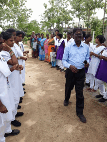 a man stands in front of a crowd of people