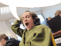 a man in a green hoodie is yawning in a classroom