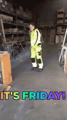 a man in a warehouse with the words " it 's friday " on the floor