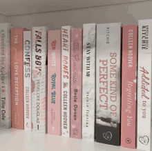 a row of books on a shelf including one titled some kind of perfect