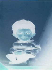 a child 's face is glowing in the dark with a blue background