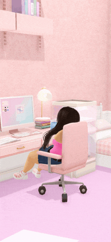 a girl sits in a pink chair in front of a pink desk with a computer