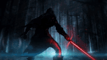 a person with a red lightsaber in the dark