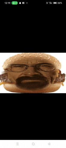 a hamburger with a man 's face on it and glasses