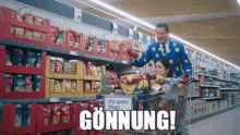 a man pushing a woman in a shopping cart in a grocery store with a sign that says " gonnung "